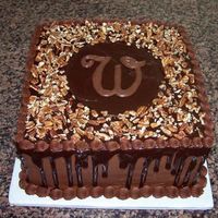 Chocolate Grooms Cake Chocolate Grooms Cake covered with ganache and pecans. Topped with the "W" initial.