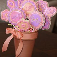 My First Cookie Bouquet! This Is Fun!! This was a simple bouquet I made with flowers and butterflies for my stepdaughters 18th birthday. I learned so much even though it was only...