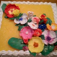 Tropical Flowers Pina Coloda cake with pinapple topping. Flowers were hand made out of Satin Ice Icing.
