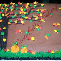 Fall_Tree_Adjusted.jpg Scratch yellow cake with chocolate buttercream icing and buttercream decorations.