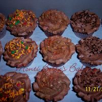 Chocolate_And_Chocolate_Cupcak.jpg Simple cupcakes. German chocolate cake with chocolate buttercream icing. These were ordered last minute for an office party.