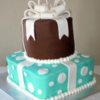 Teal & Brown Presents Buttercream 6" round and 8" square. Fondant accents and fondant/gumpaste bow.