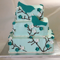 Teal Birds Wedding 6" - 8" - 10" square tiers with BC icing, fondant flowers and gumpaste birds.