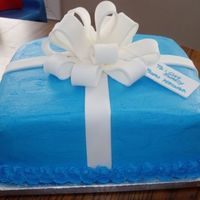 Baby Shower Double layer 12 inch square with buttercream icing. Fondant bow and fondant gift tag!