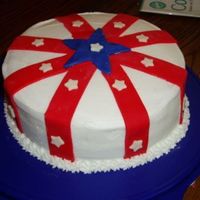 Memorial Day Cake This is a double layer 8in round cake. Covered with BC icing and ble,red and white MMF accents. (My kids punched out the white stars for me...
