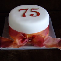 75Th Birthday Cake Fondant cake with ribbon. 75 is made out of chocolate