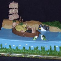 Fishing Cake Cake I made for my friend's husband. Was fun to make, man, boat and fish are out of fondant, sign is made from chocolate.