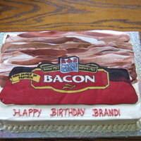Bacon Cake My cousin was having a bacon birthday bash so I made this cake for her. Iced in buttercream, bacon is made of mmf and the bacon label is...