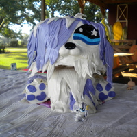 Littlest Pet Shop Shaggy Dog Daughter's 6th Birthday and Pet Shop party. 3 8inch rounds carved for the head and two loaf pans for the body. Cupcakes for the legs....