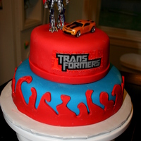Transfomers! My son is obsessed with Transformers, so naturally for his 5th birthday that was the theme. Confetti cake covered in fondant with a couple...