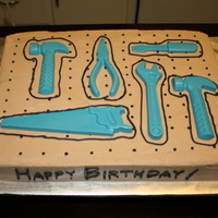 Tools On A Pegboard This cake was a French Vanilla cake with buttercream frosting and chocolate tool decorations. The design was inspired by kakesbykitty. I...