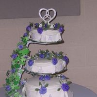 100_1769.jpg A Better picture of my best friend's wedding cake. It was beautiful :)