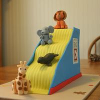 The Big E Slide This was a cake for my first cake competition. The competition was held at "The Big E" in West Springfield, MA. The theme was a...