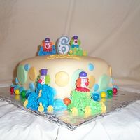 Clown Cake Yellow rolled fondant. Colorful clowns.