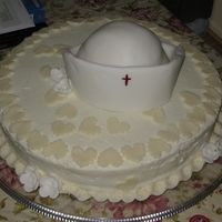 Nursing School Graduation I made this cake for my dear friend's daughter who graduated from nursing school.The cap on top is a cake baked into a small pyrex...