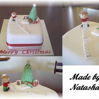 Natashachristmas.jpg 6inch fruitcake marzipanned and covered with FondX. My first time working with marzipan. Found it very difficult to use and so my cake...
