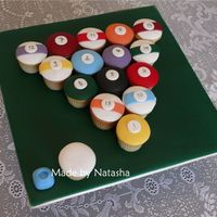 Pool Balls White chocolate cupcakes covered with fondant, inspired by several other cakes I've seen.