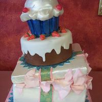 Present, Cake , And Cupcake I made this cake in a decorating course by Collette Peters. It was an amazing experience and will always remember it. The cake is made with...