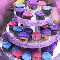 Disney Princesses Cupcake Tower Cupcake tower featuring the Disney Princesses including the ribbon around the cake boards and the cupcake papers.