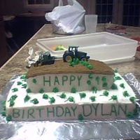 Att00097.jpg THIS IS A CAKE THAT I MADE FOR A FRIEND OF MINE. HIS LITTLE BOYS WAS TURNING 7 AND LOVES JOHN DEERE