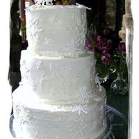 Snowflake Dream This cake was fun to do - there is a mix of royal icing snowflakes, buttercream hand-drawn snowflakes, and snowflake imprints all mixed...