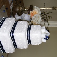 Navy Stripes Fondant bow was interlaced with real navy/silver ribbon for a nice effect.