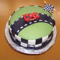 Cars Cake My son is tired of the frilly, feminine "girl" cakes I have been making, so I made this one up for him.