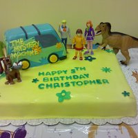 Scooby Doo Cake Yellow cake with milk chocolate buttercream icing, chocolate ganache filling, and fondant accents. The Mystery Machine is also yellow cake...