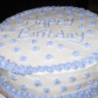 Img_0465.jpg First Cake for Wilton. Yellow cake with buttercream. We learned zig zags, stars, and writing.