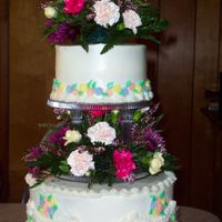 100_3520.jpg I made this for my Grandmothers 80th Birthday party. This cake was taken off of the wedding cake from Wilton Bridal Cakes. I just played...