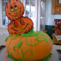 Pumpkin Patch Cake I made this for my dad's birthday. It's 2 bundt cakes with bc frosting. The stem (hard to see) was made from a heating core. The...