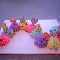 Caterpillar Cake I did this for my son's first birthday. I used Wilton's mini ball pan and decorated with pull-out stars.