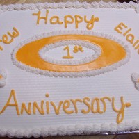 Oakley Anniv Cake White cake with bbc icing and the oakley "O" is fondant.