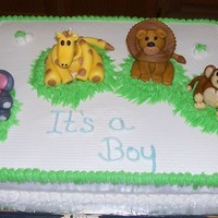 Baby Animal Cake White cake with fondant Animals. My first try at fondant animals. I love them all but the Giraffe is my favorite.