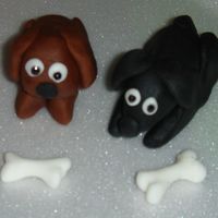 Dogs Dogs and bones made from fondant to resemble owner's dogs for birthday cake.