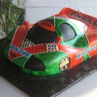 Race Car Grooms Cake This cake was based off of a Mazda race car that the groom loves. WACSC with buttercream covered in fondant and hand painted with food...