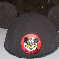 Mickey Mouse Ears Carved from 1x10" and 1x 8" round cake, covered in SMBC and black fondant- ears are made of chocolate colored black and fondant-...