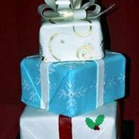 Stacked Christmas/holiday Gifts covered in fondant with white chocolate bow.