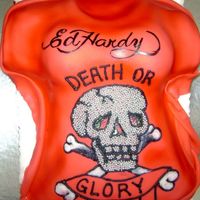 Ed Hardy Ladies T T-shirt cake done for an Ed Hardy fan. Used a pic of her shirt to make this similar design. Skull supposed to be rhinestones...LOL