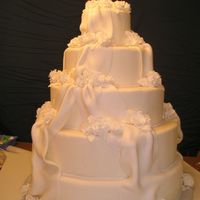 My First Fondant Cake I used the marshmallow fondant recipe from this website for this, my first fondant wedding cake. It was easy to work with and very tasty.