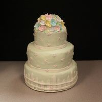 Back Yard Reception I did this for a bride who was having a back yard reception. All the flowers and fenceare made from fondant. Thanks for looking.