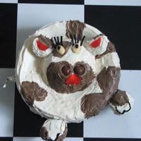 Cow base made out of round cake pan then flipped upside down right away on plate (to give it a sunkin effect. Head small (4 inch) bunt pan....