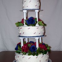 3 Tier Wedding Cake This is one of my first wedding cakes. It is a 6/8/12 white cake with all buttercream icing. Silk flowers are between the layers, but they...