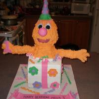 Sesame Street Present is cake covered in fondant. Character is made of rice crispy treats covered in Royal Icing.