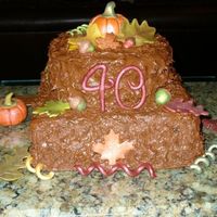 Fall 40Th B-Day Cake 10 in square choc. cake with 8 in round butter cake, choc hot fudge buttercream. My friend wanted a rustic fall themed cake similar to one...