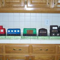 All Aboard The Honeymoon Express This was a groom's cake. It was a chocolate cake covered in chocolate fondant, mmf with gumpaste accents. The groom's grandmother...