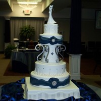 Ramont Wedding This is the tallest cake I have done. It was a lot of fun to design and see come together. The jewelry is real. The scrolls are aluminum...