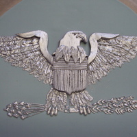 Silver Eagle This eagle was hand done using royal icing. The main body was fondant. It went on the top of a cake at a Colonel's retirement party.
