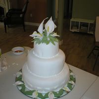 First Real Wedding Cake fondant with gumpaste calla lilies. Never taken a gumpaste class. Found how to make calla lilies on this website. Thank you for that...