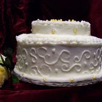 Cake3.jpg This is my 3rd attempt at a cake. I made a dark chocolate cake and used the buttercream dream recipe I found on this site. The beads I made...